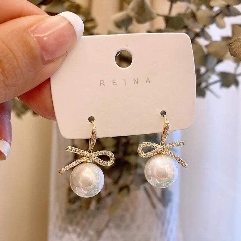 Pearl Bowknot Drop Earrings – Pink Accent