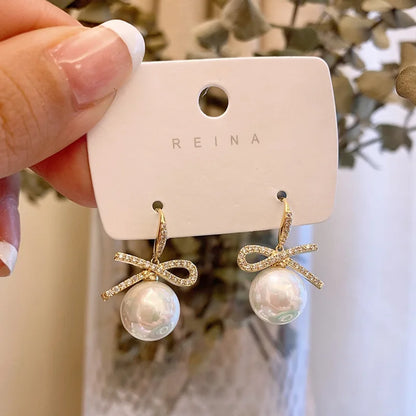 Pearl Bowknot Drop Earrings – Pink Accent