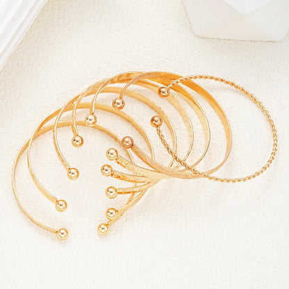 7-Piece Gold Punk Bracelet Set for Women – Streetwear Edge