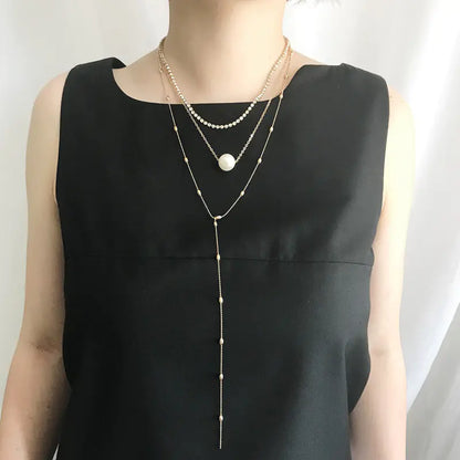 Elegant Pearl Layered Necklace with Crystal Pendant